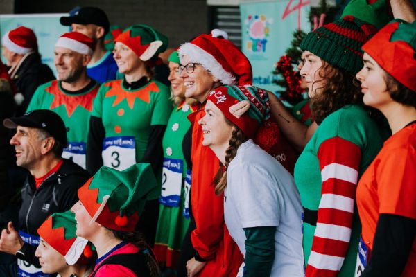 Costumed runners pose for a group photo