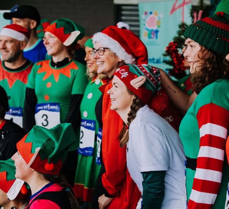 Costumed runners pose for a group photo