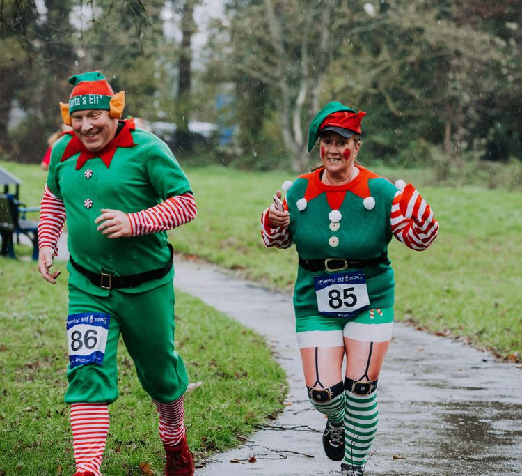 Two runners in elaborate elf outfits
