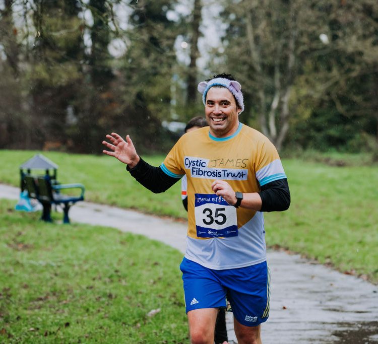 Runner smiling as he passes the camera