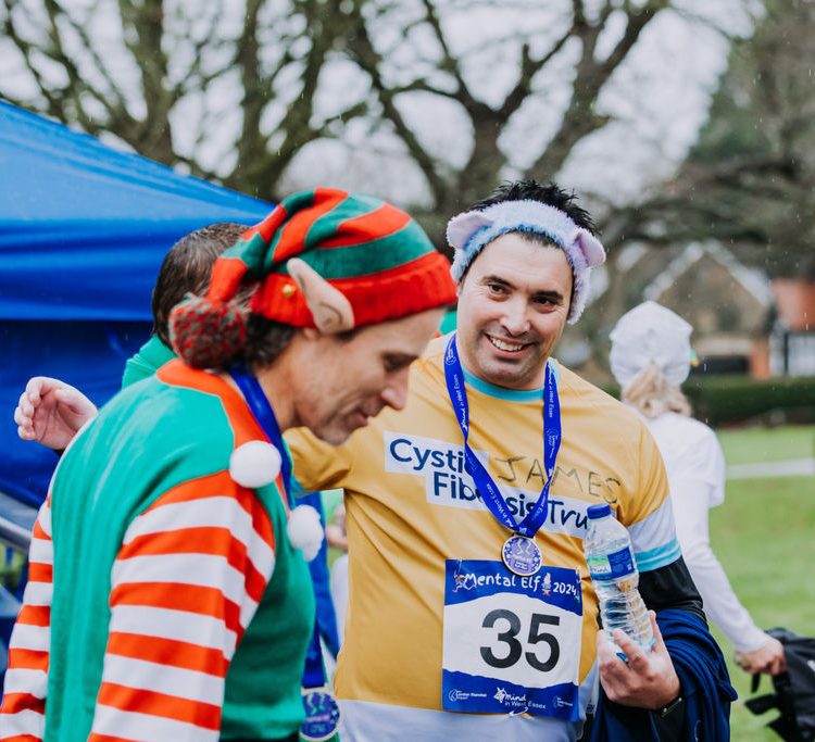 Two men standing together after the run