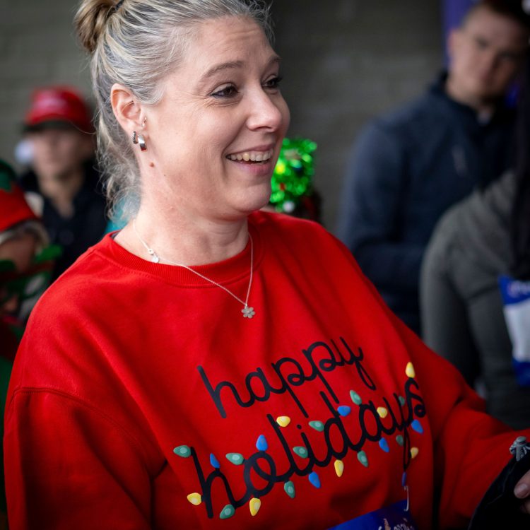 Laughing woman in a Christmas jumper