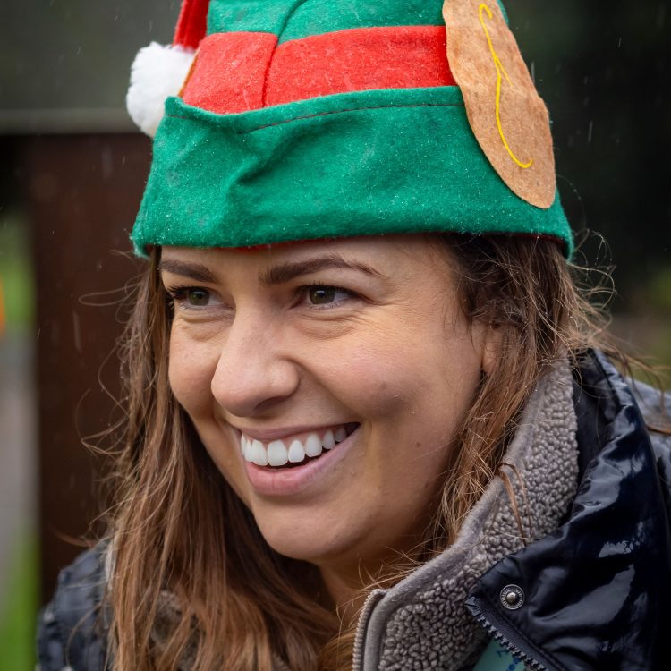 Portrait shot of smiling woman in elf hat