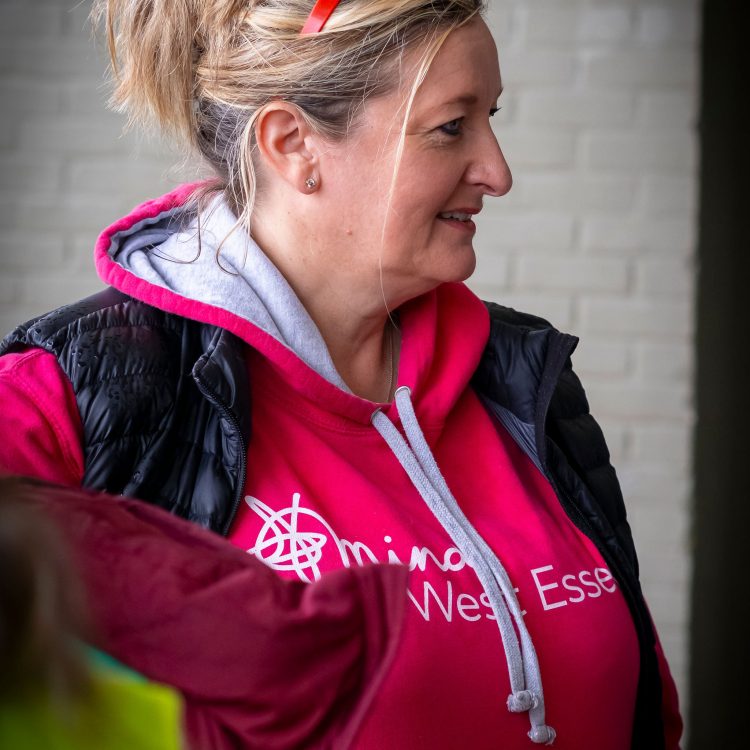 Woman in pink Mind in West Essex hoodie