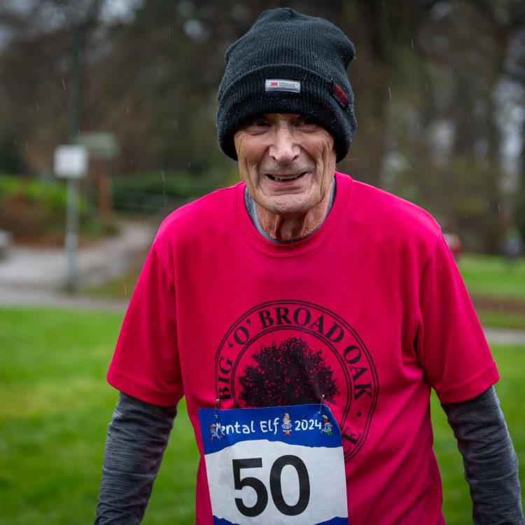 Portrait shot of a man wearing the race number 50