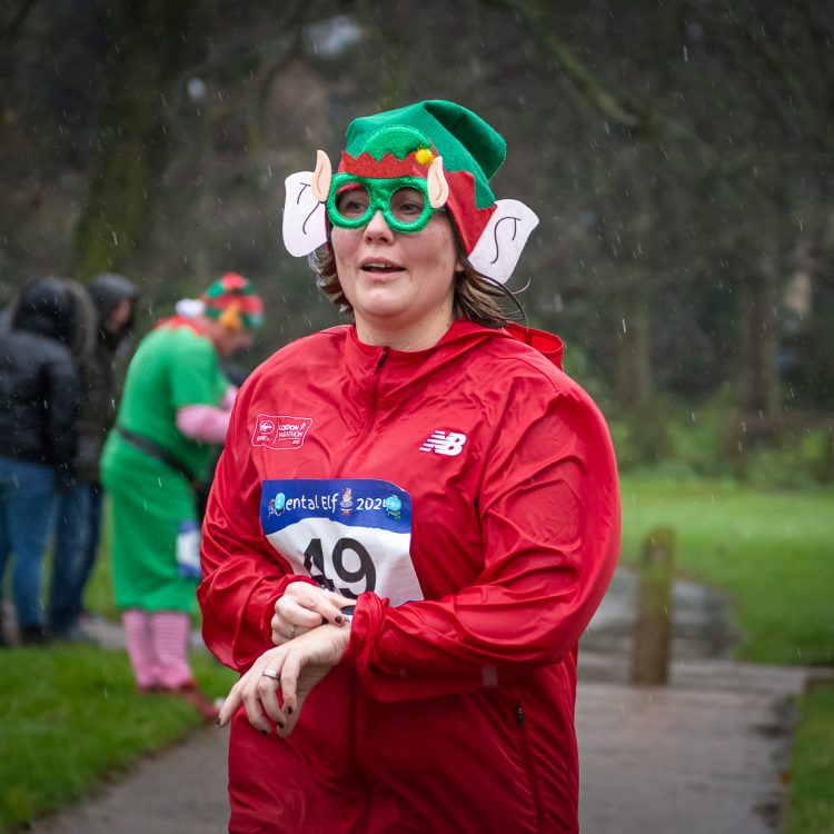 Close up shot of a runner wearing an elaborate elf hat