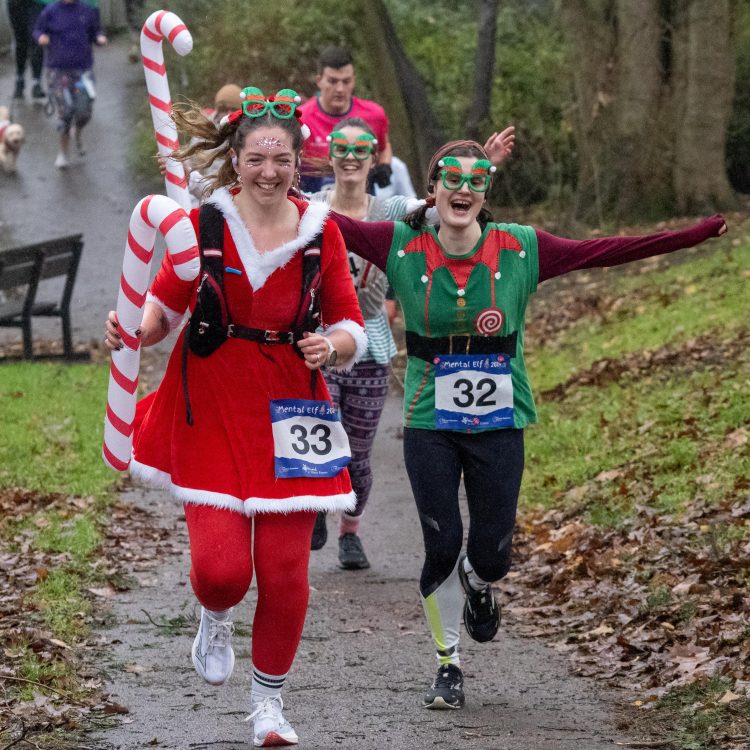 People dressed as elves running