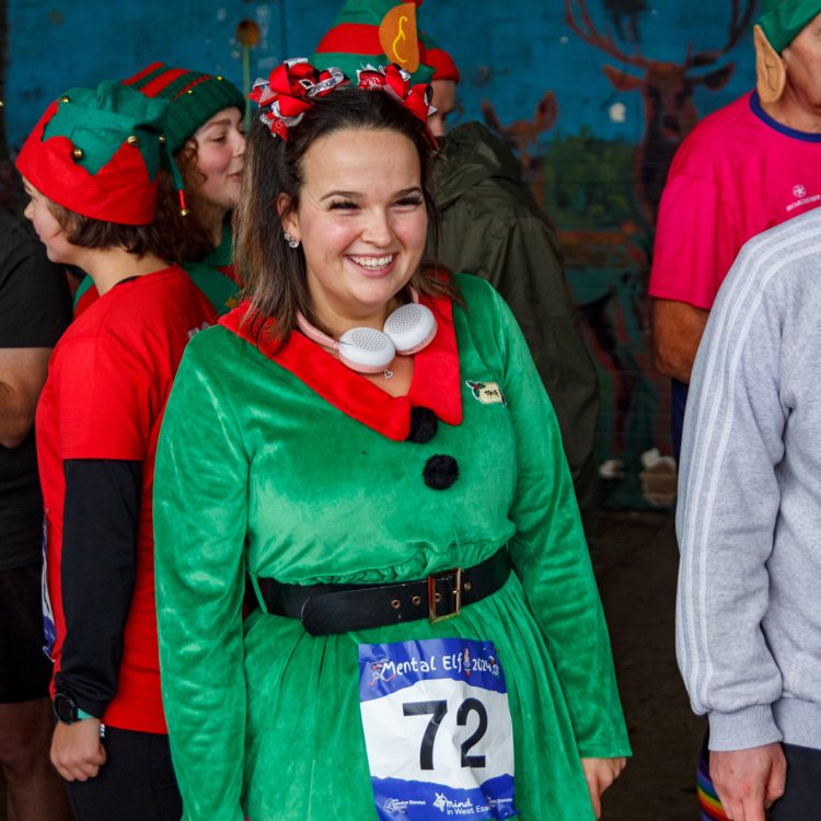 Woman smiling, dressed as an elf