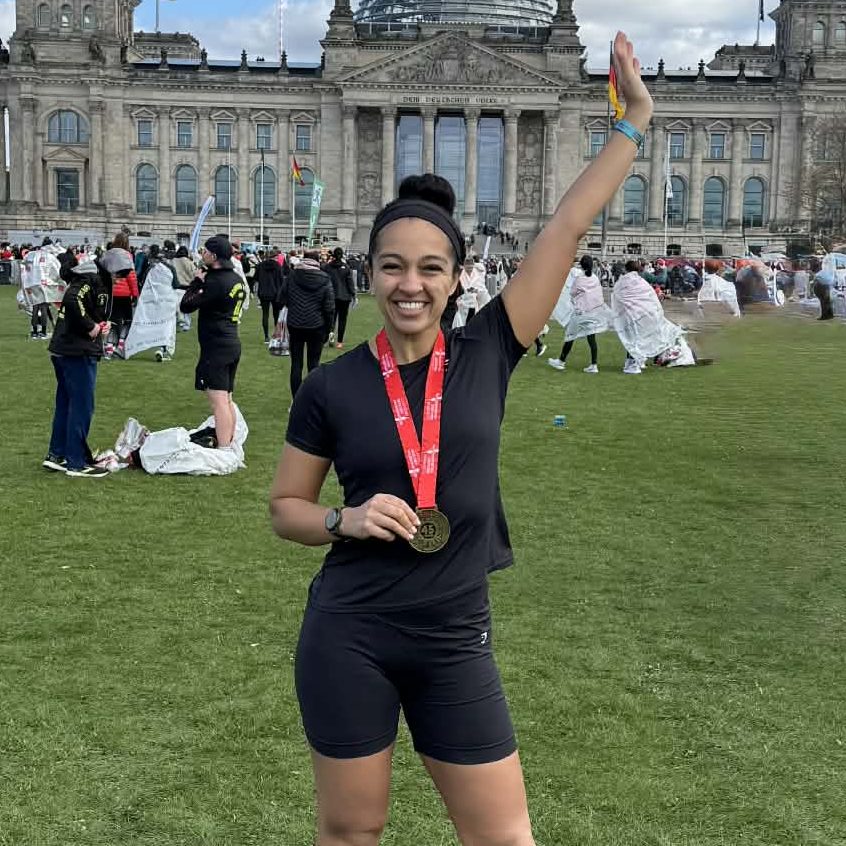 Naomi Oiku poses with her medal after completing the Berlin half-marathon